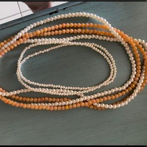 Layering pearl necklaces
